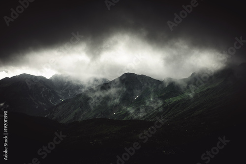 Картината върху платно Stormy alpine landscape with fog and grey cloud