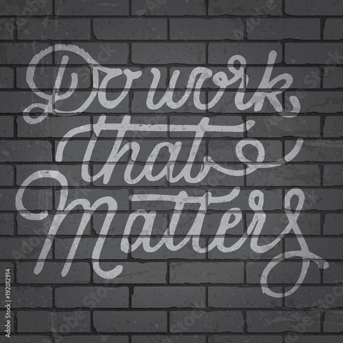 Hand drawn lettering slogan on brick wall background