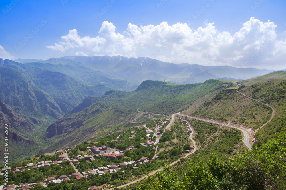 A view of the village of Alidzor, the mountains and the gorge. The blue summer sky. Beautiful scenery, Armenia.	