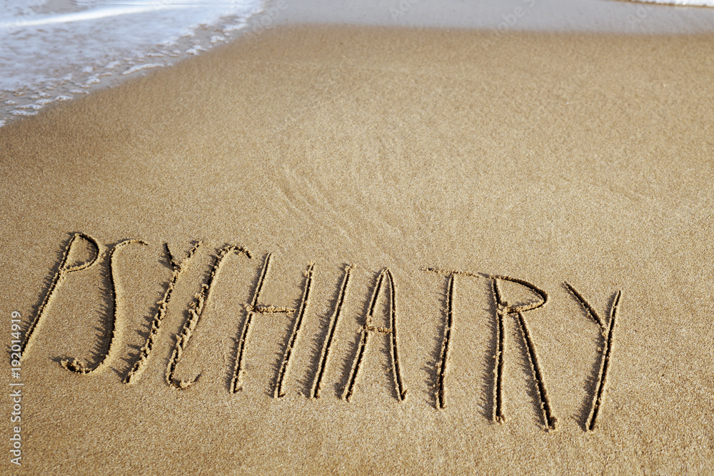 Εκτύπωση καμβά word psychiatry in the sand of a beach