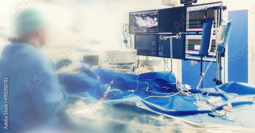 Cardiologist doing catheter ablation with radiofrequency energy using imaging system with fluoroscopic X-ray tube for interventional vascular procedures and electrophysiology. image guided system photo