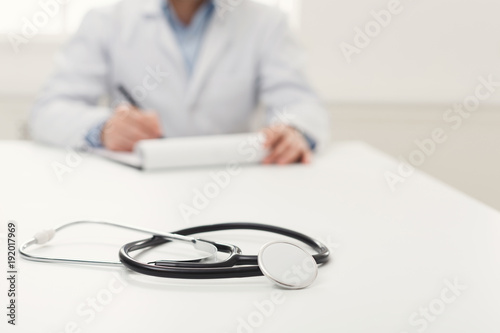 Stethoscope on the desk, selective focus