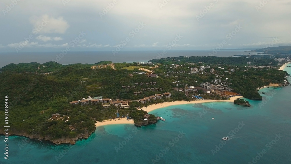Aerial view of beautiful tropical island with white sand beach, Boracay, hotels and tourists. Tropical lagoon with turquoise water and white sand. Beautiful sky, sea, beach, resort. Seascape: Ocean Aerial view of beautiful tropical island with white sand beach, Boracay, hotels and tourists. Tropical lagoon with turquoise water and white sand. Beautiful sky, sea, beach, resort. Seascape: Ocean