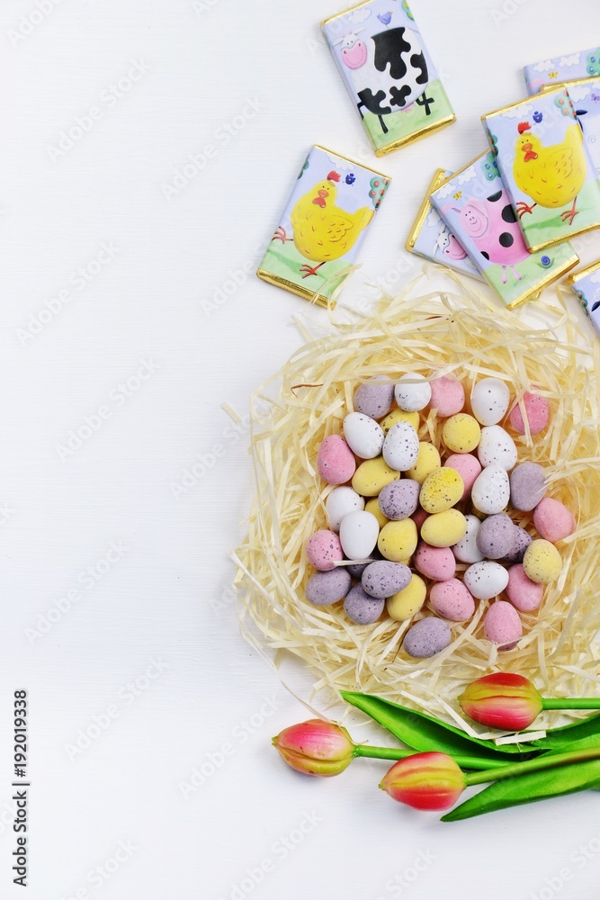 Easter eggs on the wooden white bacakground with copy space. Top view, flat lay Easter eggs on the wooden white bacakground with copy space. Top view, flat lay