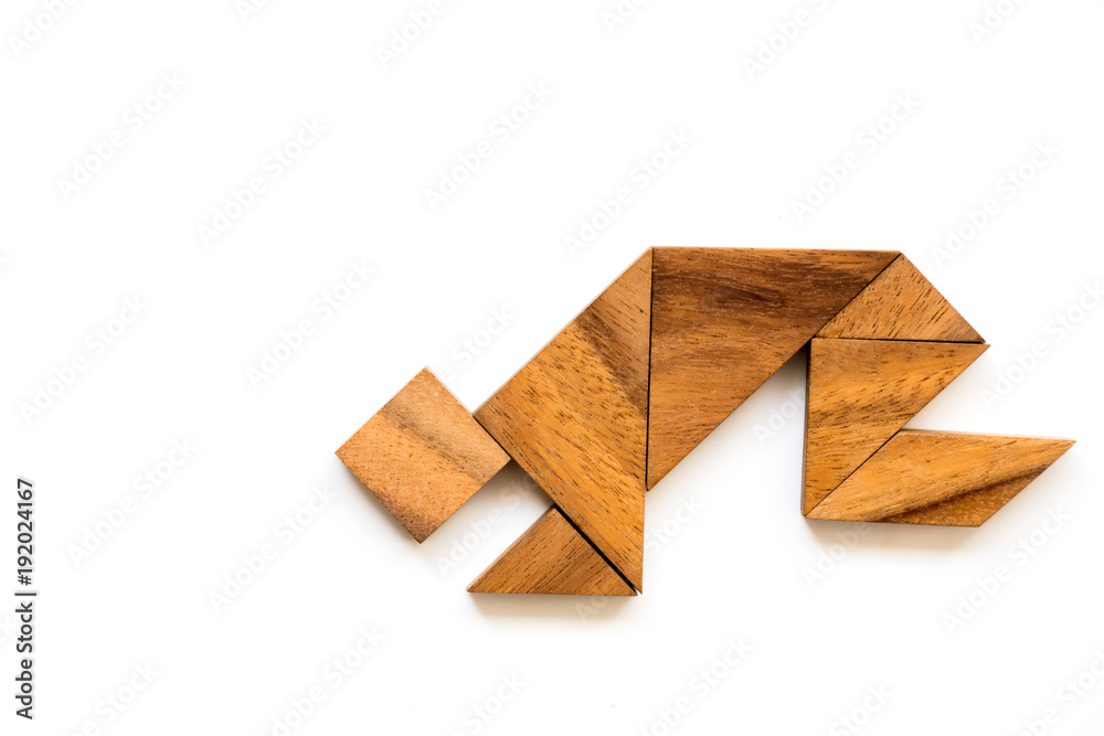 Wood tangram puzzle in man that squat or worship shape on white background
