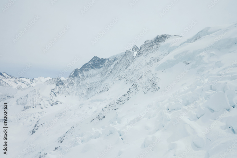 View on the peak of the biggest glacier of jungfrau. Bernese Oberland, Switzerland. Swiss Alps View on the peak of the biggest glacier of jungfrau. Bernese Oberland, Switzerland. Swiss Alps