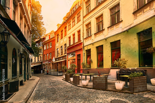 Old medieval morning narrow street in Riga, Latvia. Retro styled. © Vladimir V