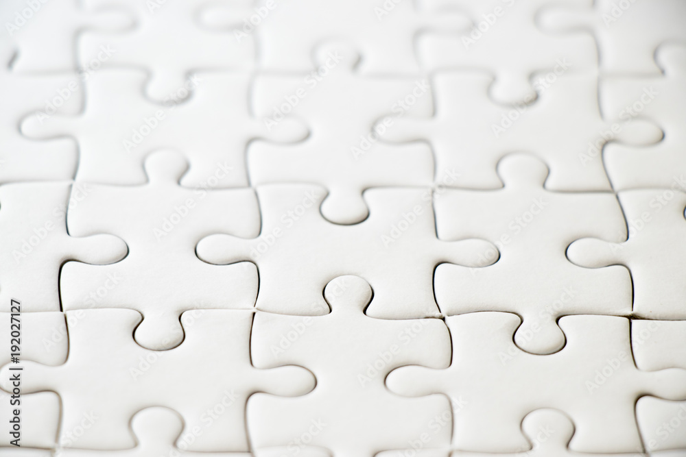 Closed up of white plain jigsaw game background Closed up of white plain jigsaw game background