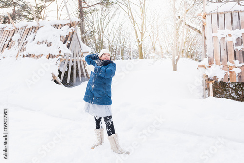 Asian girl playing snow © ztranger