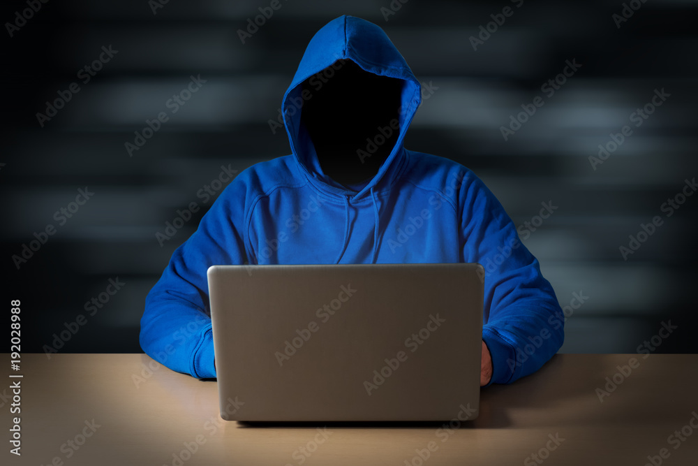 Computer hacker steals data from laptop. Theft of personal data and computer crimes Computer hacker steals data from laptop. Theft of personal data and computer crimes