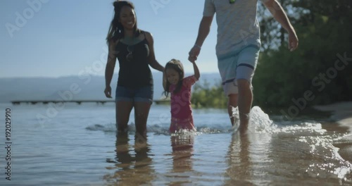 4k Multi ethnic family splashing in surf at lake tahoe