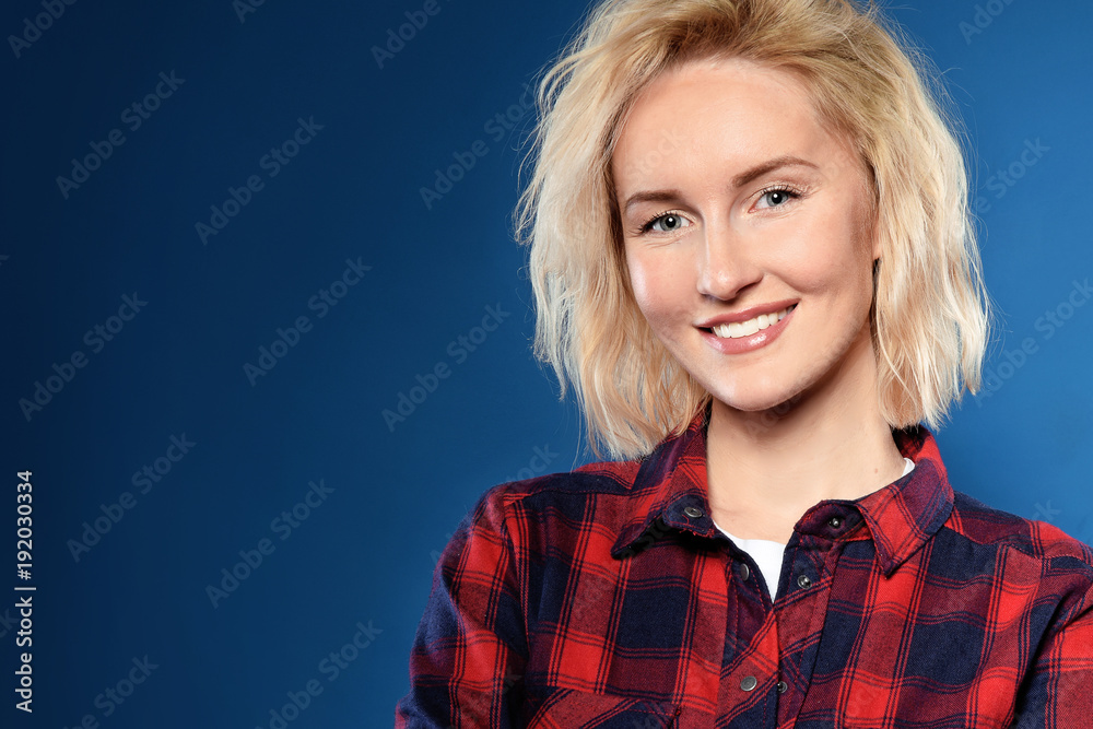 beautiful blonde woman in red shirt isolated dark blue background in happy and smiling. Pretty girl with blue eyes is thinking something nice beautiful blonde woman in red shirt isolated dark blue background in happy and smiling. Pretty girl with blue eyes is thinking something nice