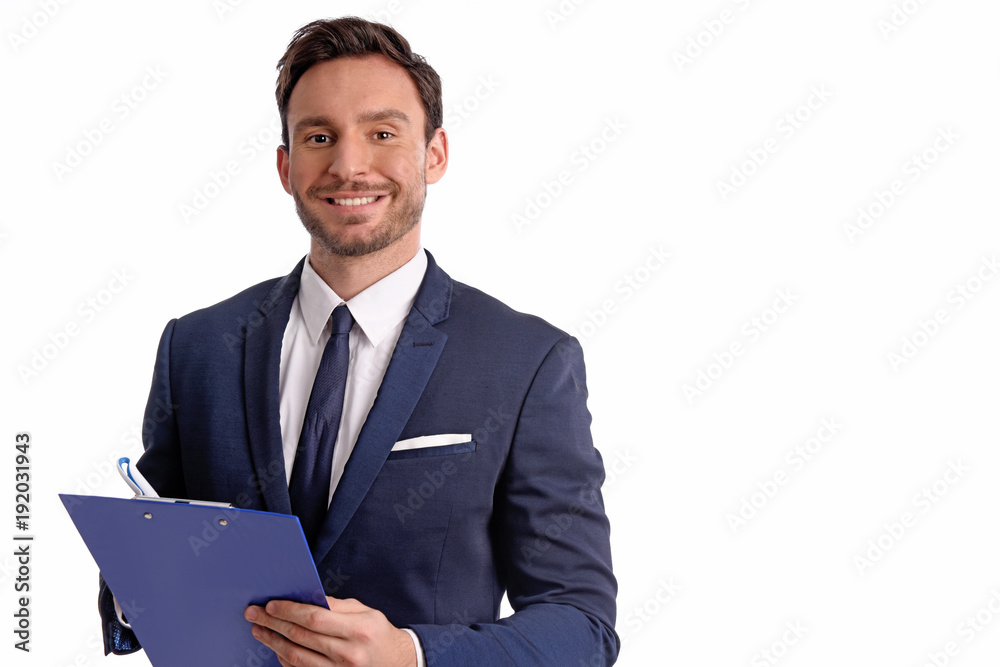 Handsome bearded businessman in office suit and tie isolated on white background. Professional bank manager is holding a blank clipboard Handsome bearded businessman in office suit and tie isolated on white background. Professional bank manager is holding a blank clipboard