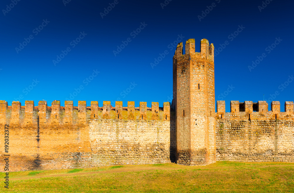 Brick wall with tower. Medieval Italian walled town