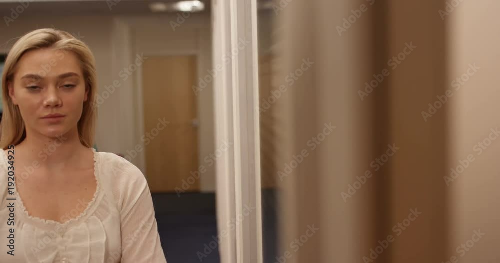 4K Portrait young serious businesswoman in the office with coworkers in background. Slow motion. 4K Portrait young serious businesswoman in the office with coworkers in background. Slow motion.