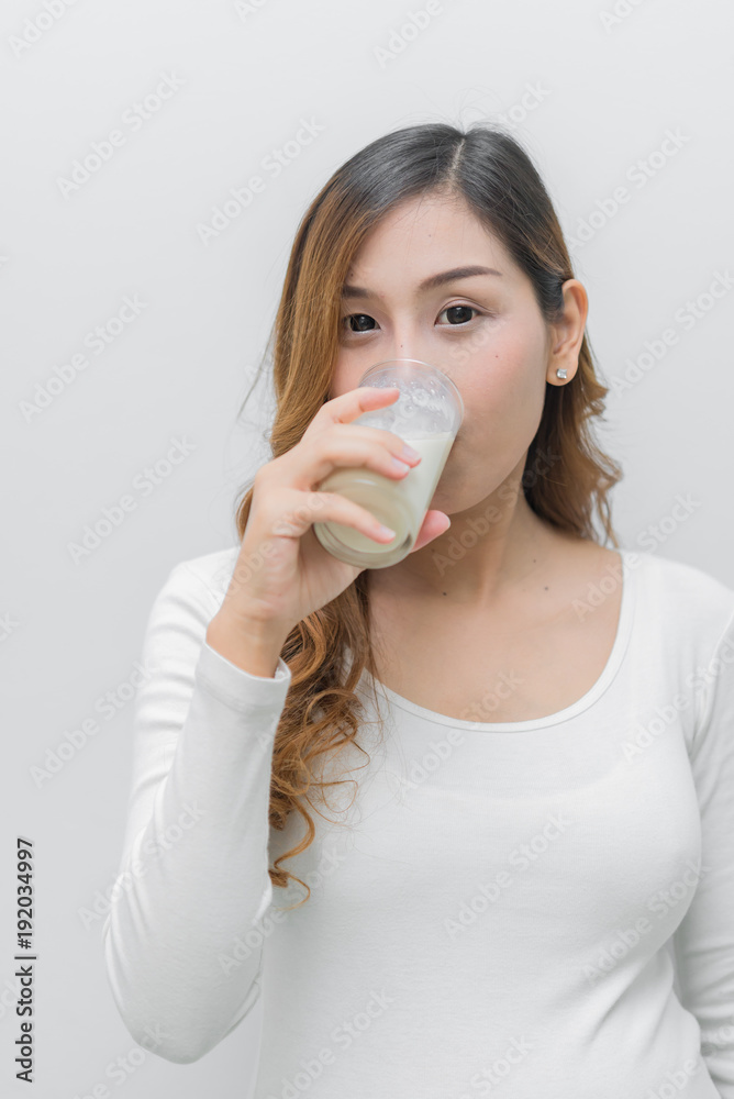 Pregnant woman with milk in her hand,Drinking milk is good health to the pregnancy Pregnant woman with milk in her hand,Drinking milk is good health to the pregnancy