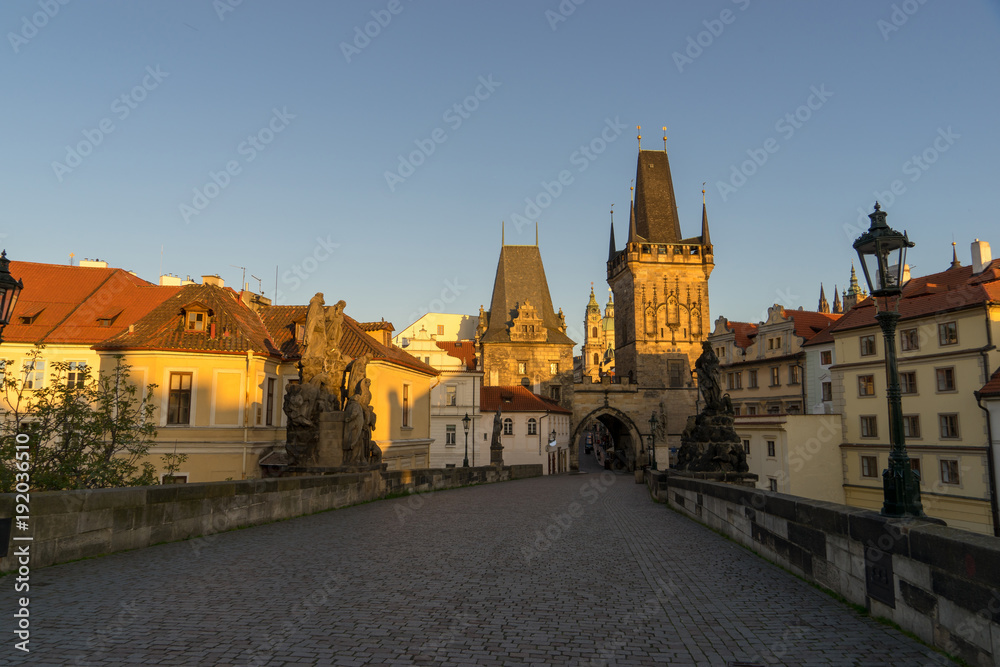 Morning sky with sunlight over the tower at Charles Bridge, Prague,Czech Republic