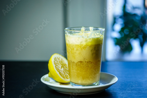 A glass of traditional drink for stamina or energy drink with eggs and tea. Teh talua or teh telor is a tea beverage from West Sumatra. The tea is unique because of the use of egg yolk. photo