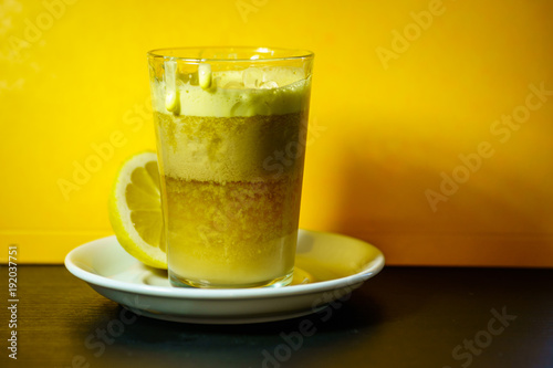 A glass of traditional drink for stamina or energy drink with eggs and tea. Teh talua or teh telor is a tea beverage from West Sumatra. The tea is unique because of the use of egg yolk.