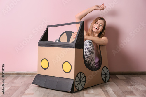 Young woman playing with ca...