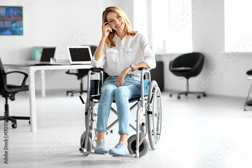Young woman in wheelchair a...