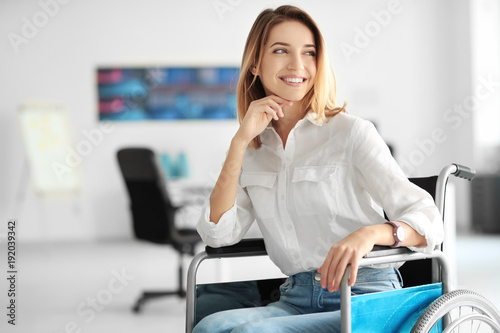 Young woman in wheelchair a...