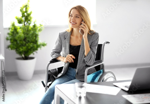 Young woman in wheelchair a...