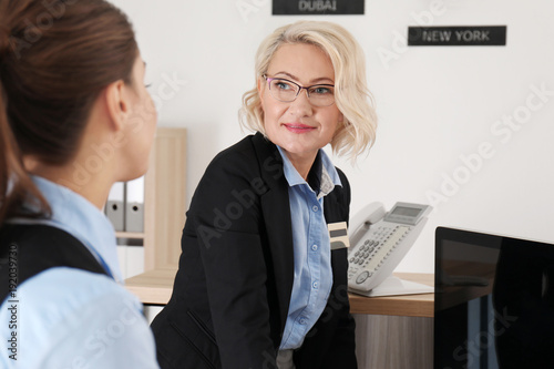 Female receptionist teachin...