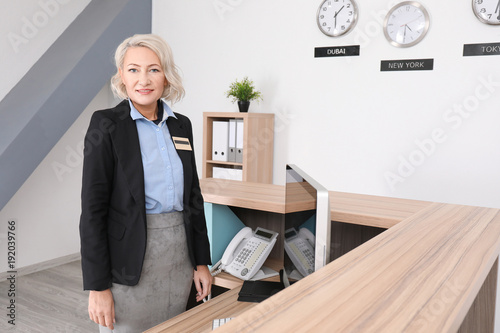 Female hotel receptionist a...