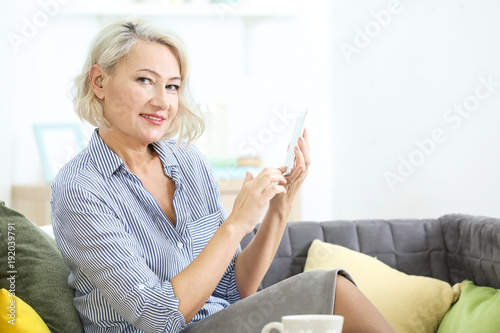 Mature woman with hearing a...