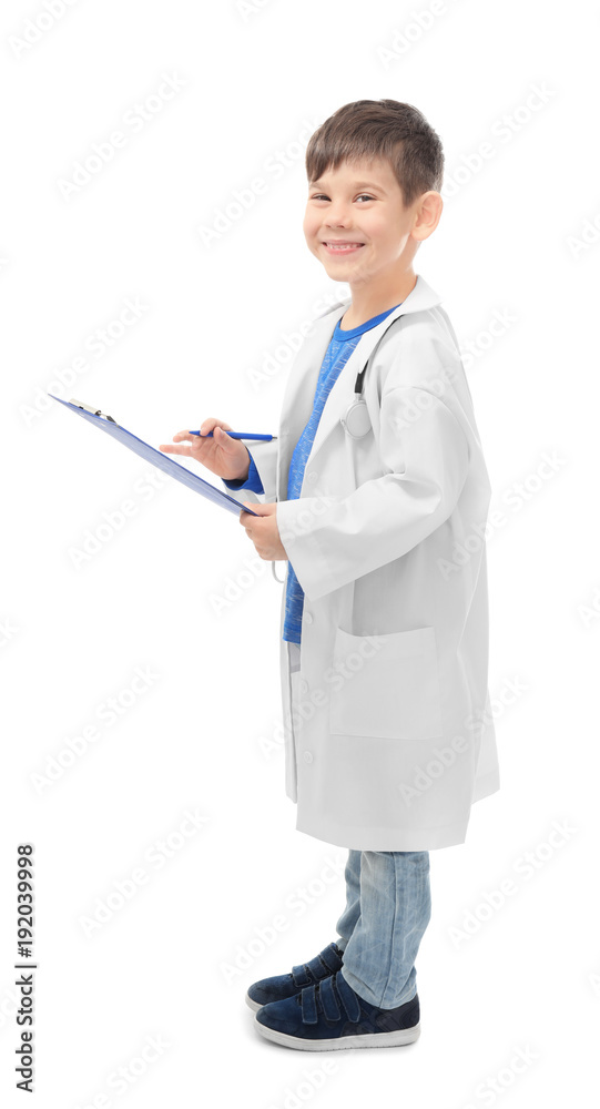Cute little boy in doctor uniform with clipboard on white background Cute little boy in doctor uniform with clipboard on white background