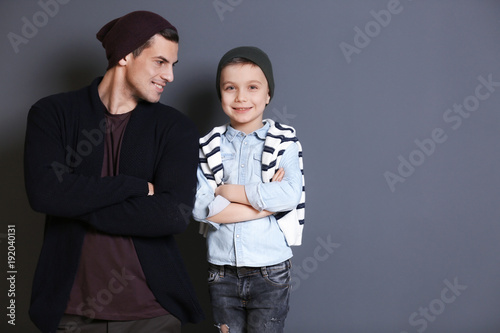 Stylish father and son on g...