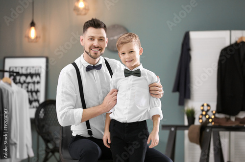 Father and son in elegant s...