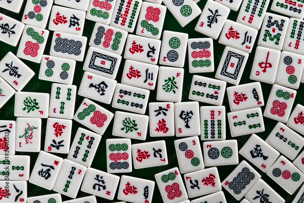 White-green tiles for mahjong on on green cloth background White-green tiles for mahjong on on green cloth background