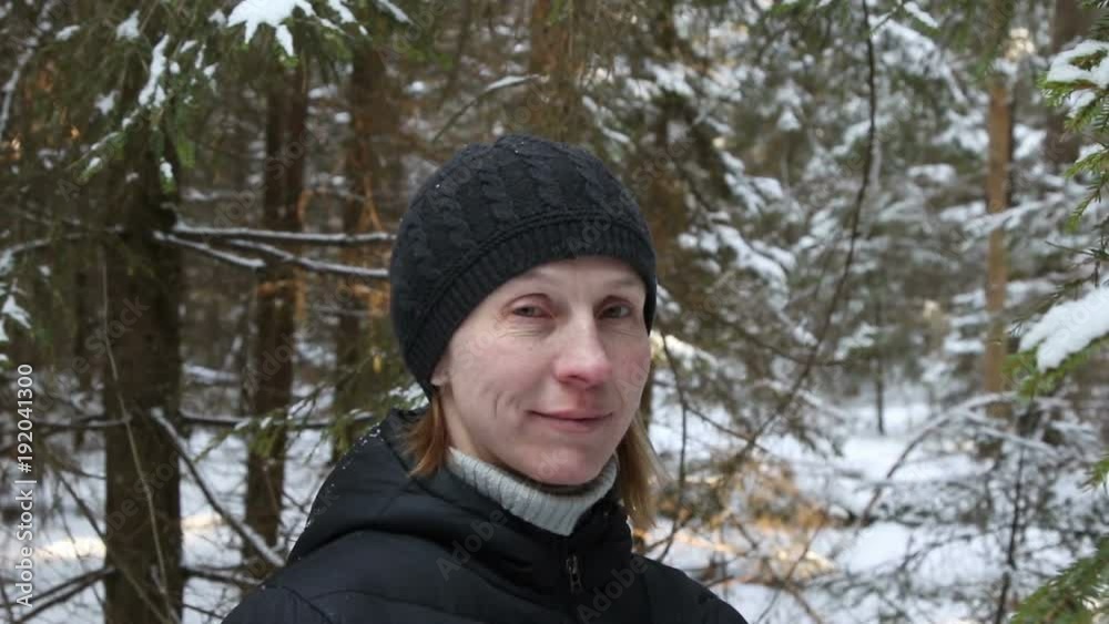 Woman in the winter forest.