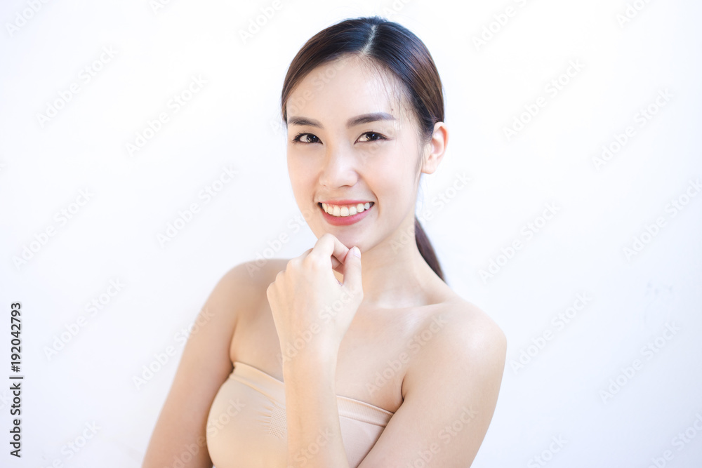 Portrait of a beautiful female model on isolated gray background Portrait of a beautiful female model on isolated gray background