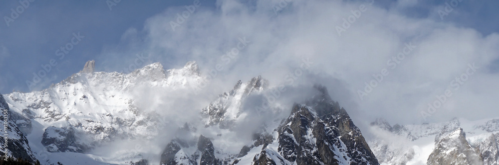Panoramic beautiful Misty mountains with foggy sunshine blue sky in morning at Alpes in Italy Panoramic beautiful Misty mountains with foggy sunshine blue sky in morning at Alpes in Italy