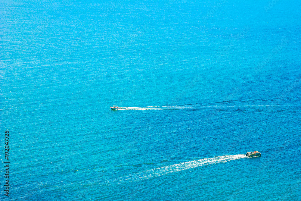 Beautiful summer sea landscape with powerboats at the resort in the turquoise waters