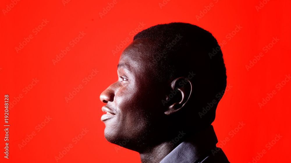 portrait of a african man on red background portrait of a african man on red background
