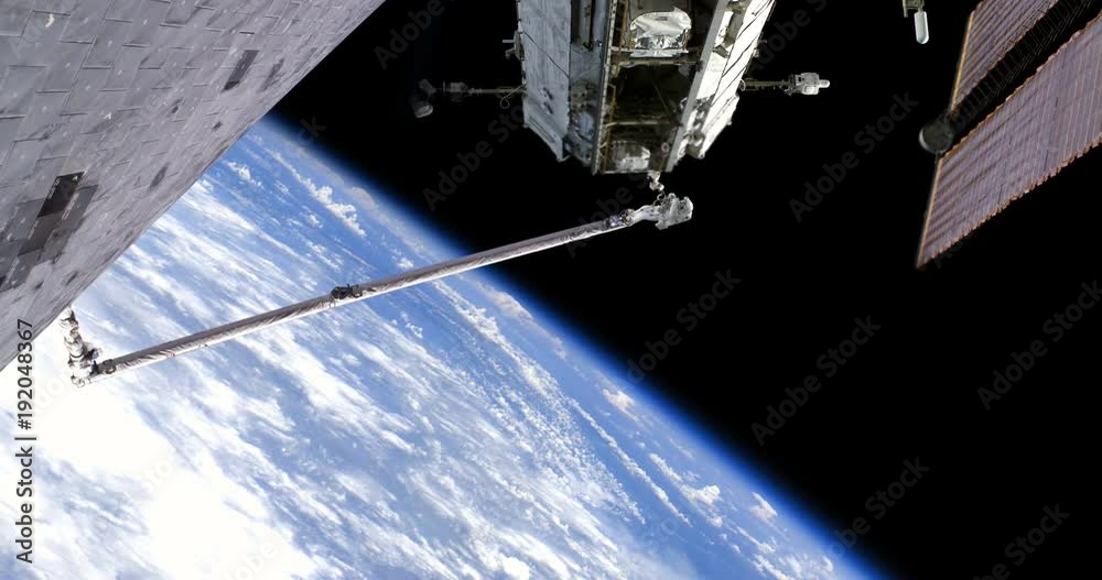 Astronaut Spacewalk on Robotic Arm From Shuttle Working on ISS, 4K some elements furnished by NASA images