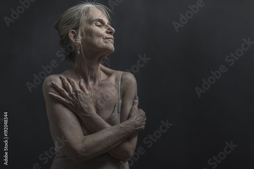 Portrait of daydreaming older Caucasian woman