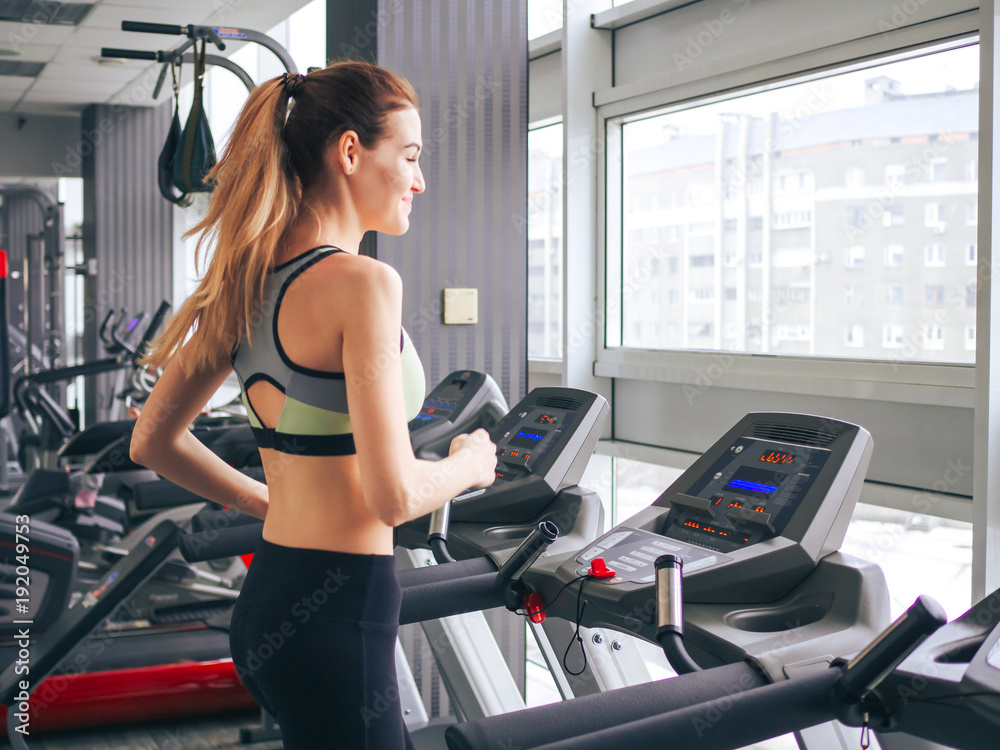 Young girl makes exercises at the gym Young girl makes exercises at the gym