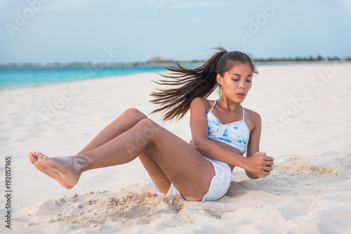 Abs Workout Fitness Woman Working Out On Beach Doing Russian Twists Abs Exercises With Raised Legs For Stomach Weight Loss Toning Fit Body Oblique Muscles Training Asian Girl Stock Photo
