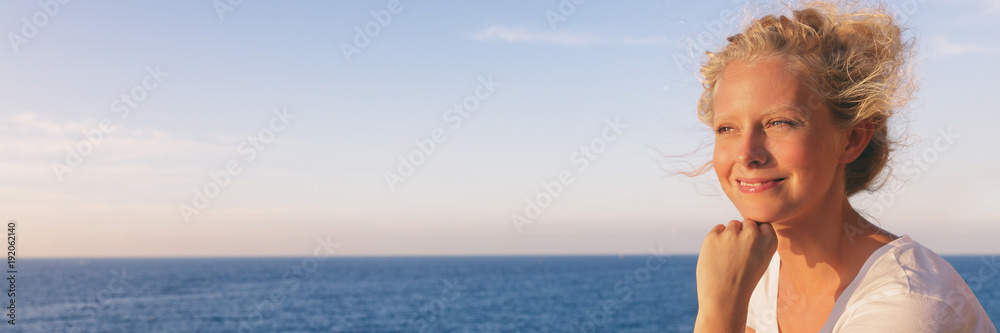 Cruise ship summer travel vacation woman relaxing at sea watching sunset. Happy blond tourist girl outside on Europe holiday destination banner panorama header. Cruise ship summer travel vacation woman relaxing at sea watching sunset. Happy blond tourist girl outside on Europe holiday destination banner panorama header.