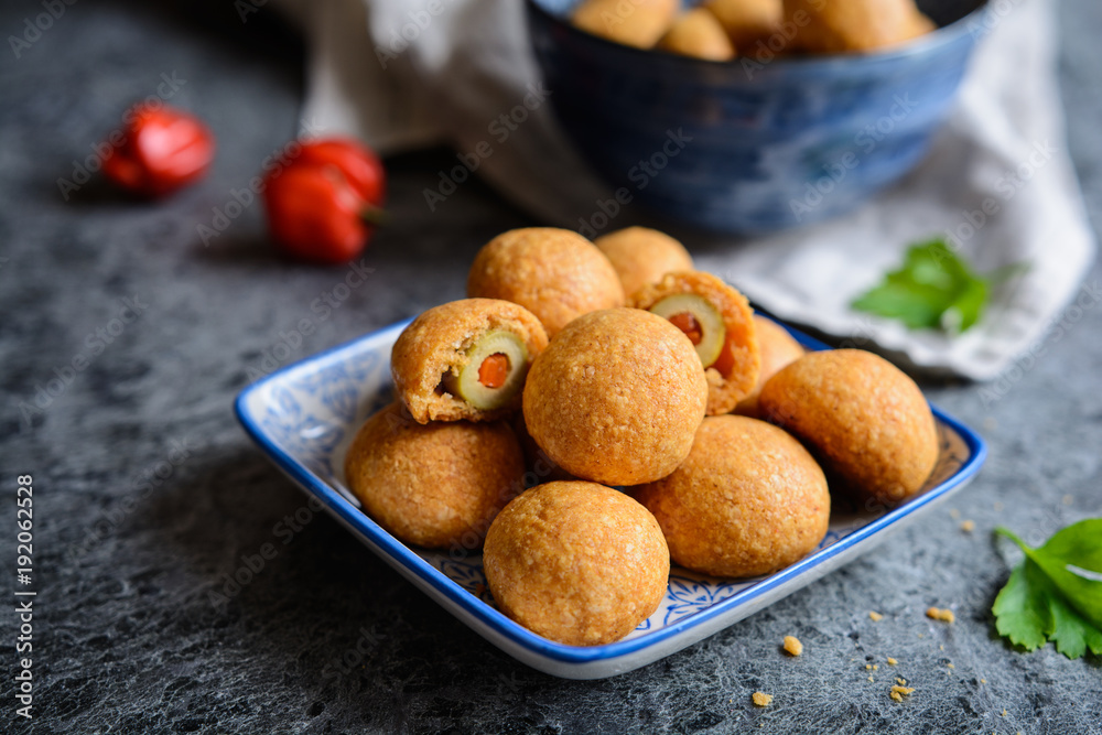 Baked olives in cheese and paprika dough
