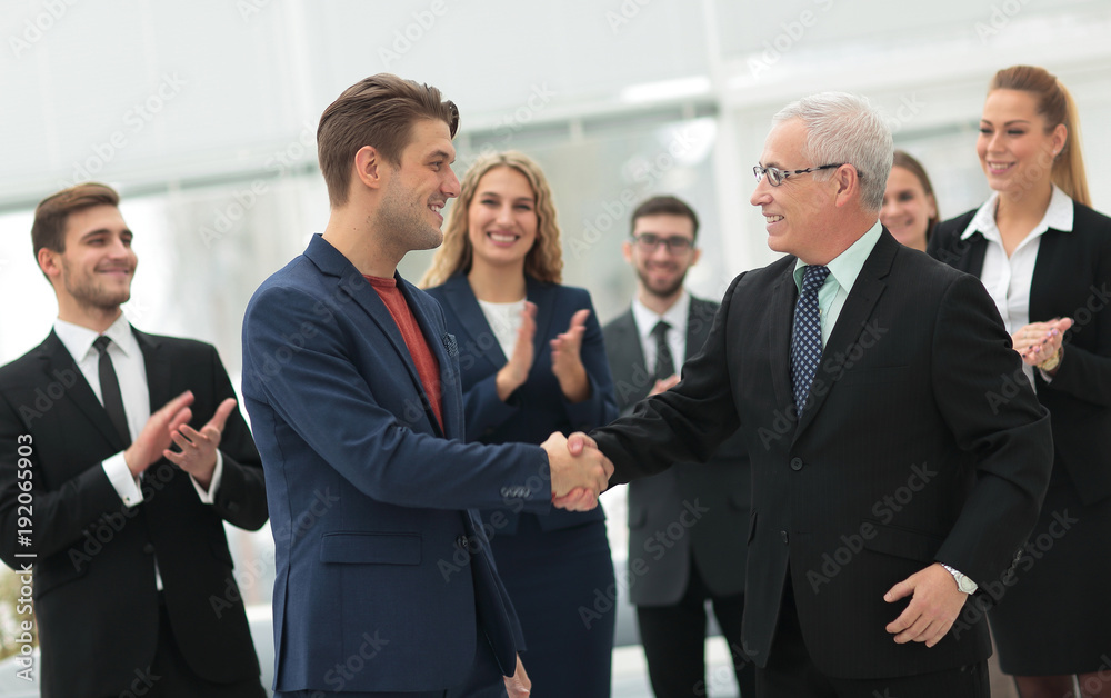 handshake of business partners after a business meeting in the office handshake of business partners after a business meeting in the office