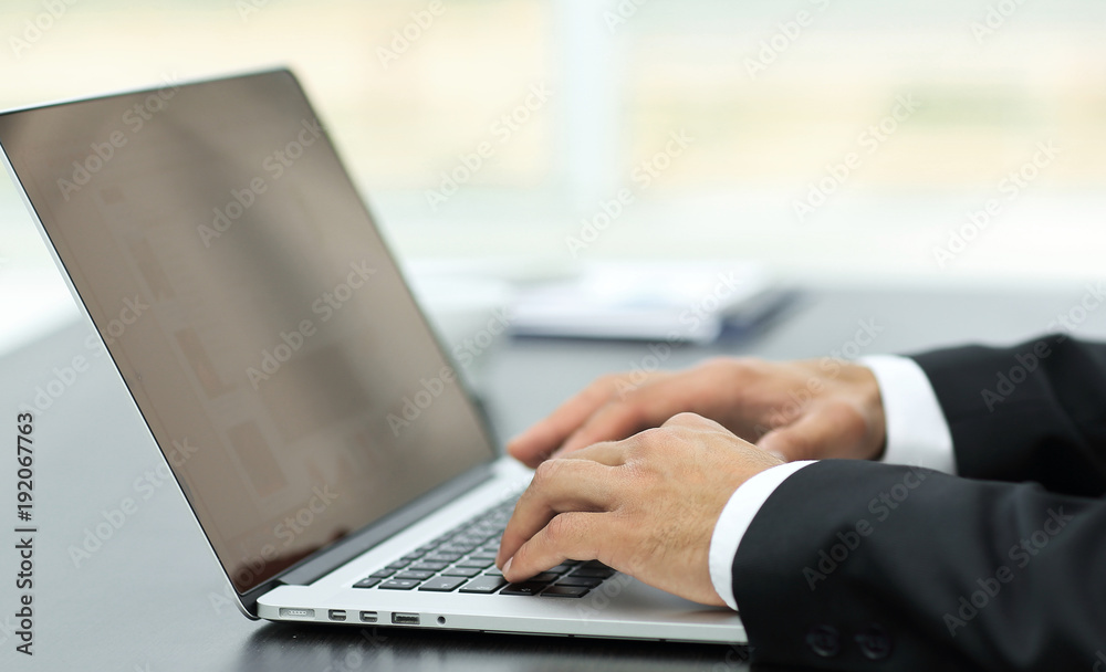 closeup.businessman working on laptop closeup.businessman working on laptop