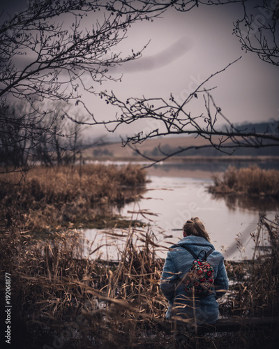 Sitting alone staring into a scottish loch