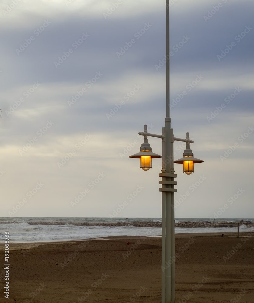 pole with lights on the beach
