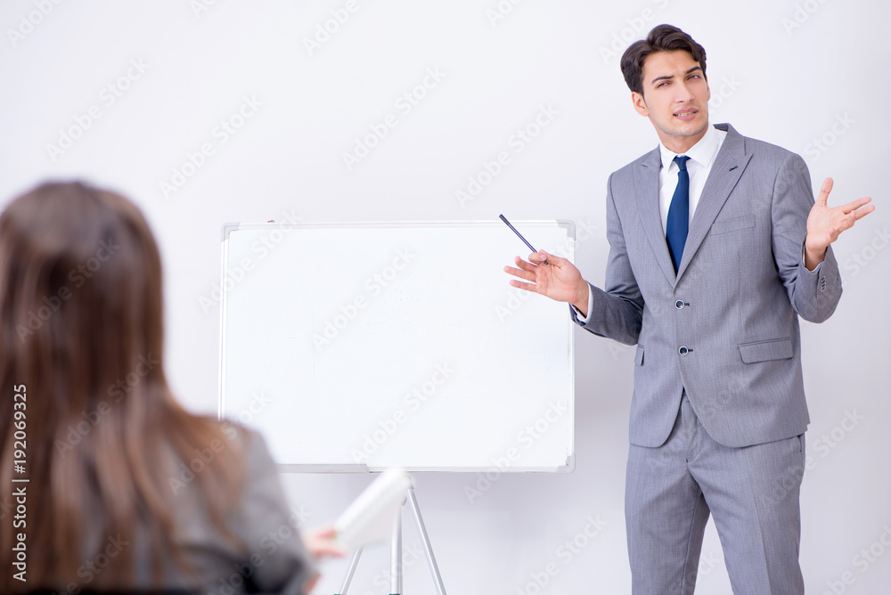 Business presentation in the office with man and woman Business presentation in the office with man and woman